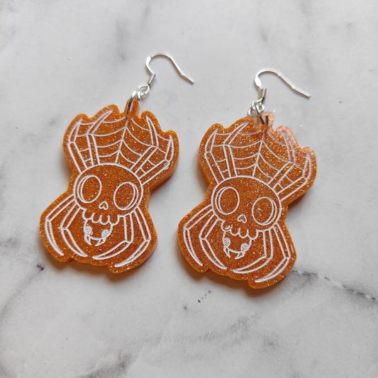 Spider Skull Earrings - Orange Glitter